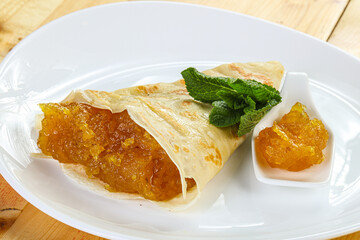 Delicous pancake with fruit jam