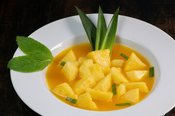 Fresh pineapple dessert recipe with mint orange coulis, hight quality photo