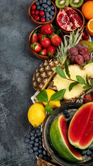Delicious raw fruit on dark background.