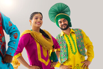 Sikh people performing bhangra together during Baisakhi celebration