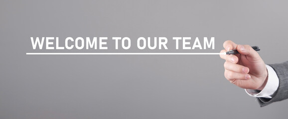 Man writes text Welcome To Our Team.