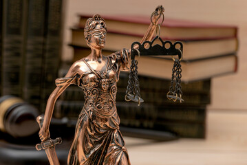 Lady Justice. Law symbols in bokeh background.
