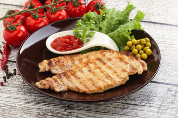 Grilled pork steak with ketchup