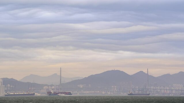 Flowing asperitas clouds above the Stonecutters Bridge, Hong Kong (4k time-lapse)