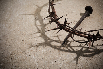 Easter concept. Crown of thorns with Nail on a stone background.