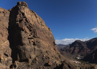 Gran Canaria, landscape of the southern part of the island along Barranco de Arguineguín steep and deep ravine
with vertical rock walls, circular hiking route visiting Elephant rock arch 
