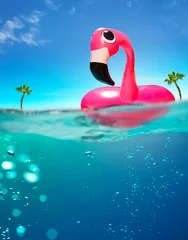 Gardinen Inflatable flamingo rubber buoy and pool underwater split photo © Sergey Novikov