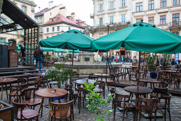 outdoors street cafe with empty tables