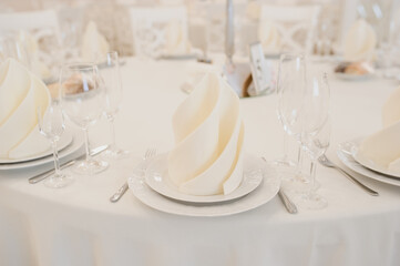 Close up arranged table with plates and glasses on a wedding