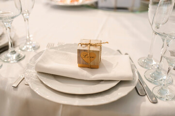 Close up arranged table with plates and glasses on a wedding