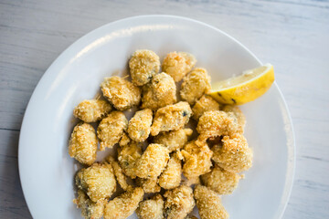 Delicious bulgarian food fried mussels  in restaurant