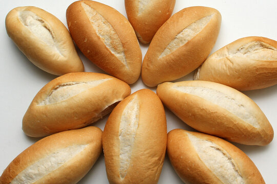 Delicious, fresh, fluffy, crunchy, hot, freshly made bun mexican bread, french bread, white, loaf baked with wheat flour on white background ready to eat
