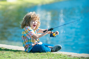 Portrait of excited amazed child boy fishing. Child surprised fishing on the lake. Young fisher....