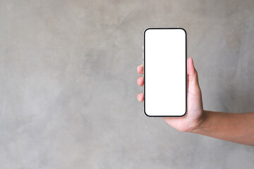 Mockup image of a woman holding and showing a mobile phone with blank desktop screen