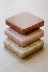 Decorative artificial stone in samples. colorful samples of artificial stone. Finishing material, interior renovation. Vertical photography.