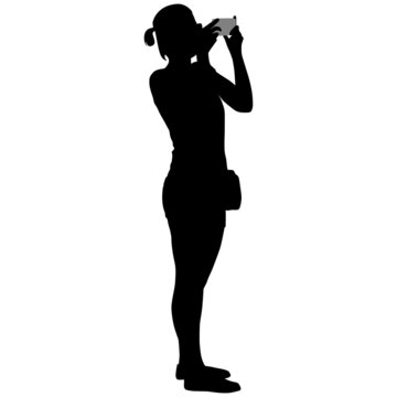 Black silhouette of woman in shorts with phone in her hands