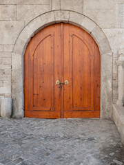 Fototapeta na wymiar historical wooden door texture background, front view
