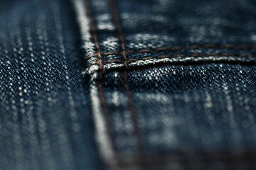 Jeans denim texture close up , focus only one point , soft blured background wallpaper