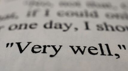 Very well text in open book page, close up, macro shot of very well word, education and novel concept, selective focus