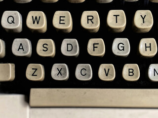 Old typewriter keyboard in vintage background. Stock photo.