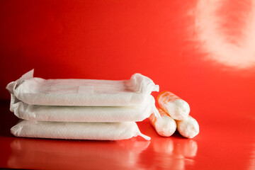 Fototapeta na wymiar feminine hygiene products on a red background