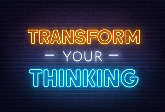 Transform your thinking neon lettering on brick wall background.