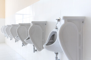 Row of urinal toilet blocks in men public toilet under construction