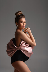 the pregnant woman poses in the studio. beautiful pregnant blonde woman.