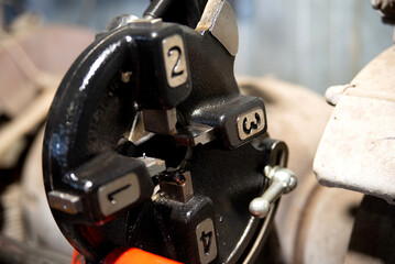Close up view of metal thread cutter. Hi-technology parts manufacturing process by turning machine
