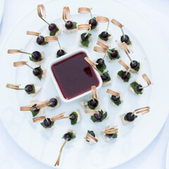  Catering banquet table with different food appetizers assortment on a party