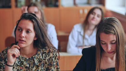 Pupils of the 11th grade in the class at the desks during the lesson. Russian school.