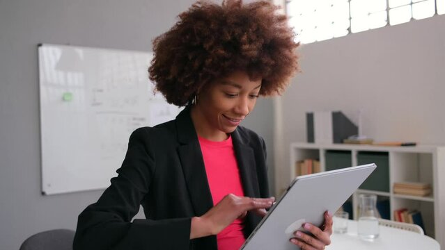 Creative businesswoman using digital tablet in office