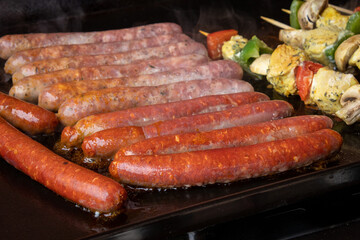sausages and merguez grilled on a barbecue