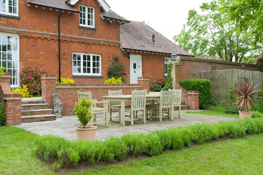 House and garden patio with furniture, UK