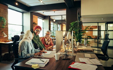 Happy businesswomen working as a team in a coworking space