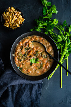 Overhead view of a bowl of traditional Georgian lobio with walnuts and coriander