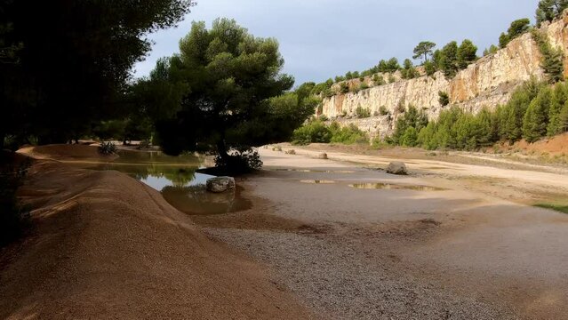 DOLLY SLOW MOTION SHOT - Rocky hiking path in mountain range Massif des Calanques near Cassis at the French Riviera, France. Walking trail near Calanque d'en vau.