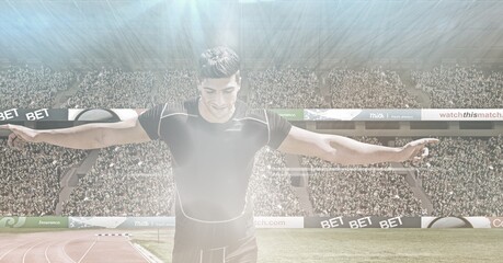 Composite image of caucasian male athlete celebrating after winning a race against sports stadium