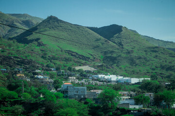 Houses next to the road leading to the hills of Fogo island on Cabo Verde towards the famous...