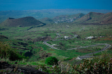 Obraz premium Curvy road to Pico do Fogo, volcano on the island of Fogo on Cabo Verde islands. Looking towards the sea with twisty road visible.