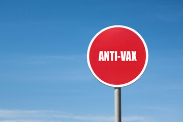 'Anti-vax' sign in round red frame. Blue sky is on background