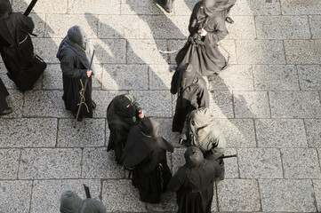 Holy Week in Zamora, Spain, procession of the Brotherhood of Jesús Nazareno Vulgo Congregation on the morning of Good Friday. Penitents dressed in black.