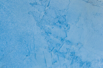 Old concrete wall worn cement background with abstract paint blue rough texture