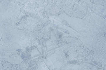 Old concrete wall worn cement background with abstract paint light blue rough texture