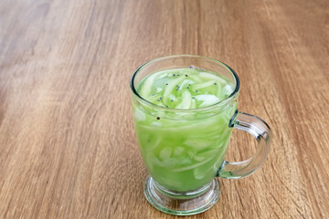 Es Kuwut, traditional Balinese fruit cocktail made from young coconut, melon, nata de coco, basil seeds, lime and syrup. Space for text
