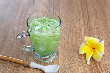 Es Kuwut, traditional Balinese fruit cocktail made from young coconut, melon, nata de coco, basil seeds, lime and syrup. Space for text
