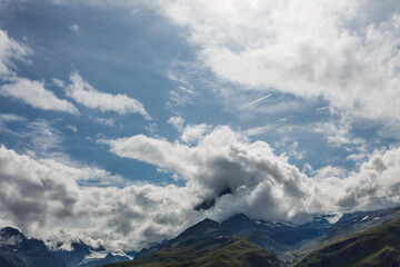 Naklejka na ściany i meble panorama mountains with clouds, switzerland