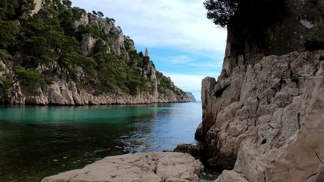 SLOW MOTION - The Calanques National Park is a French national park located on the Mediterranean coast in Bouches-du-Rh&ocirc;ne, France. The beach of En-Vau and its high limestone cliffs.