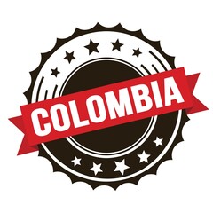 COLOMBIA text on red brown ribbon stamp.