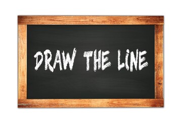 Obraz premium DRAW THE LINE text written on wooden frame school blackboard.